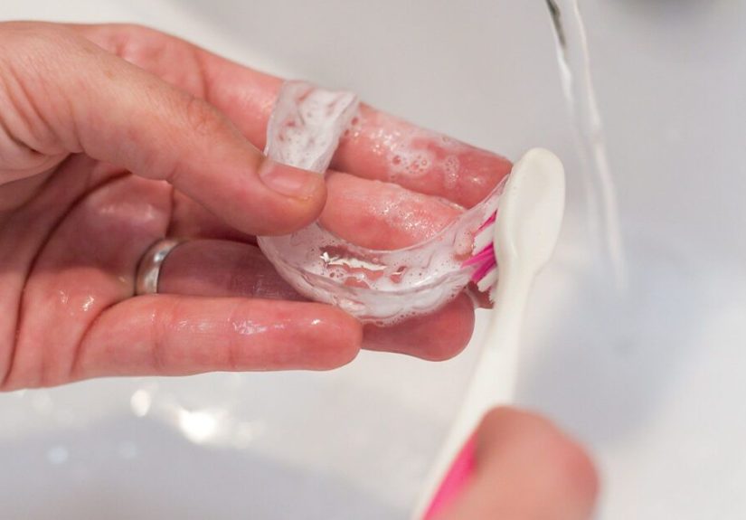How to Clean Invisalign: Tips, Prevention, and More